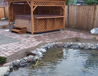 Landscaping with pavers and pond